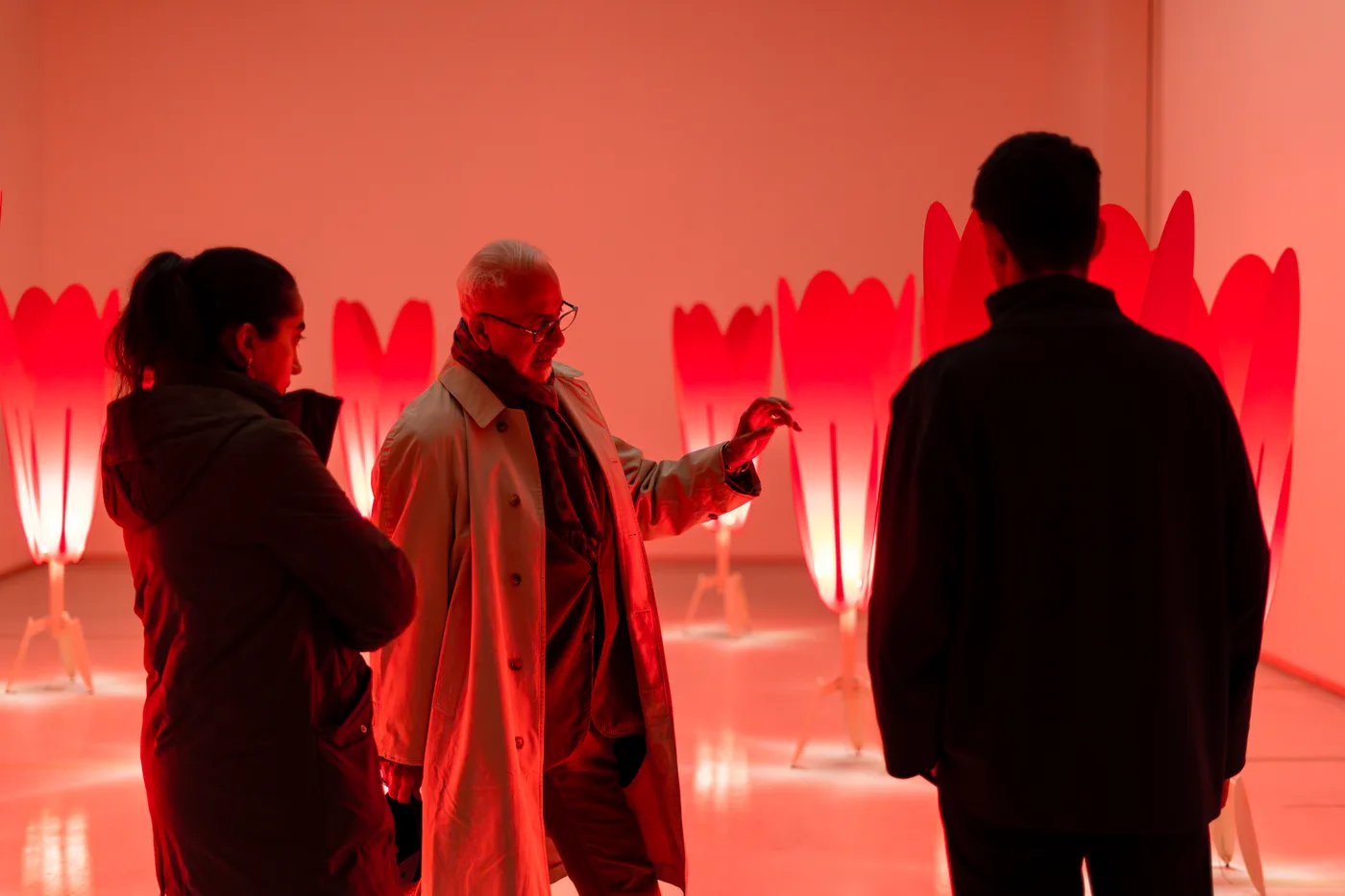 Visitors in conversation at the opening