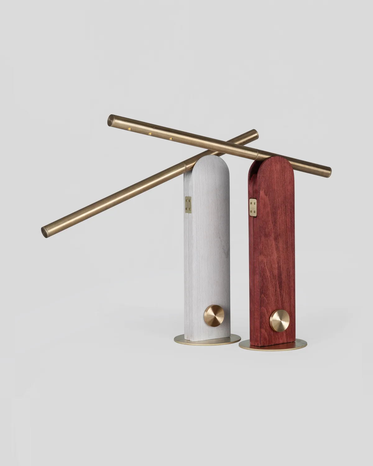 Two Parade table lamps in white and oxblood with brass arms