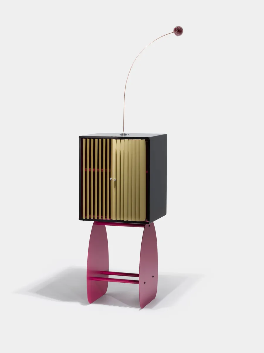 The Secret Cabinet — golden slats on a soft pink base, antenna on top