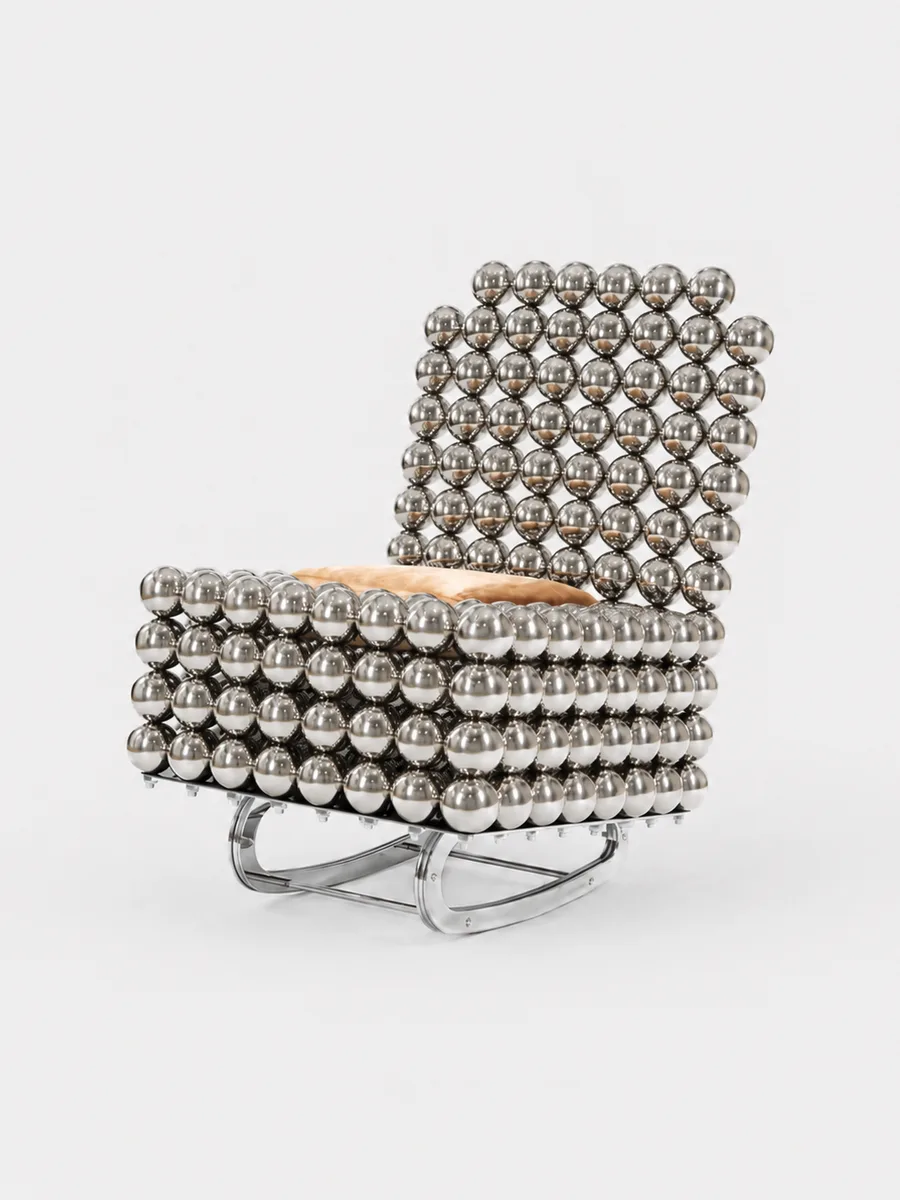 The Wishes rocking chair — chrome spheres cradling a fur cushion