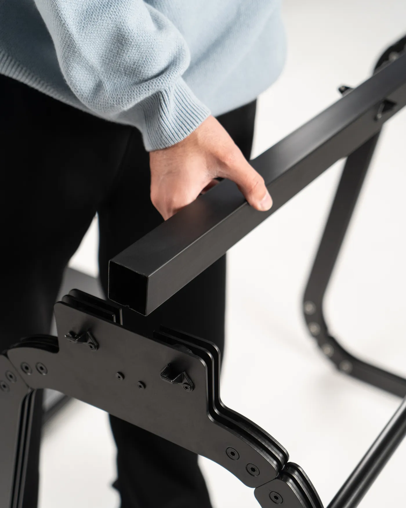 Carrying the Arte table's steel frame