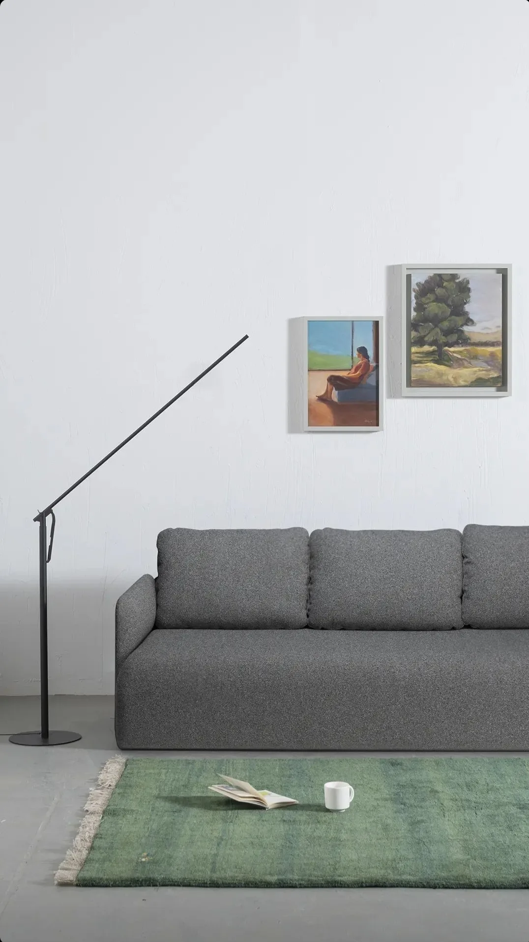 Calibre at home behind a sofa, arm reaching over the backrest
