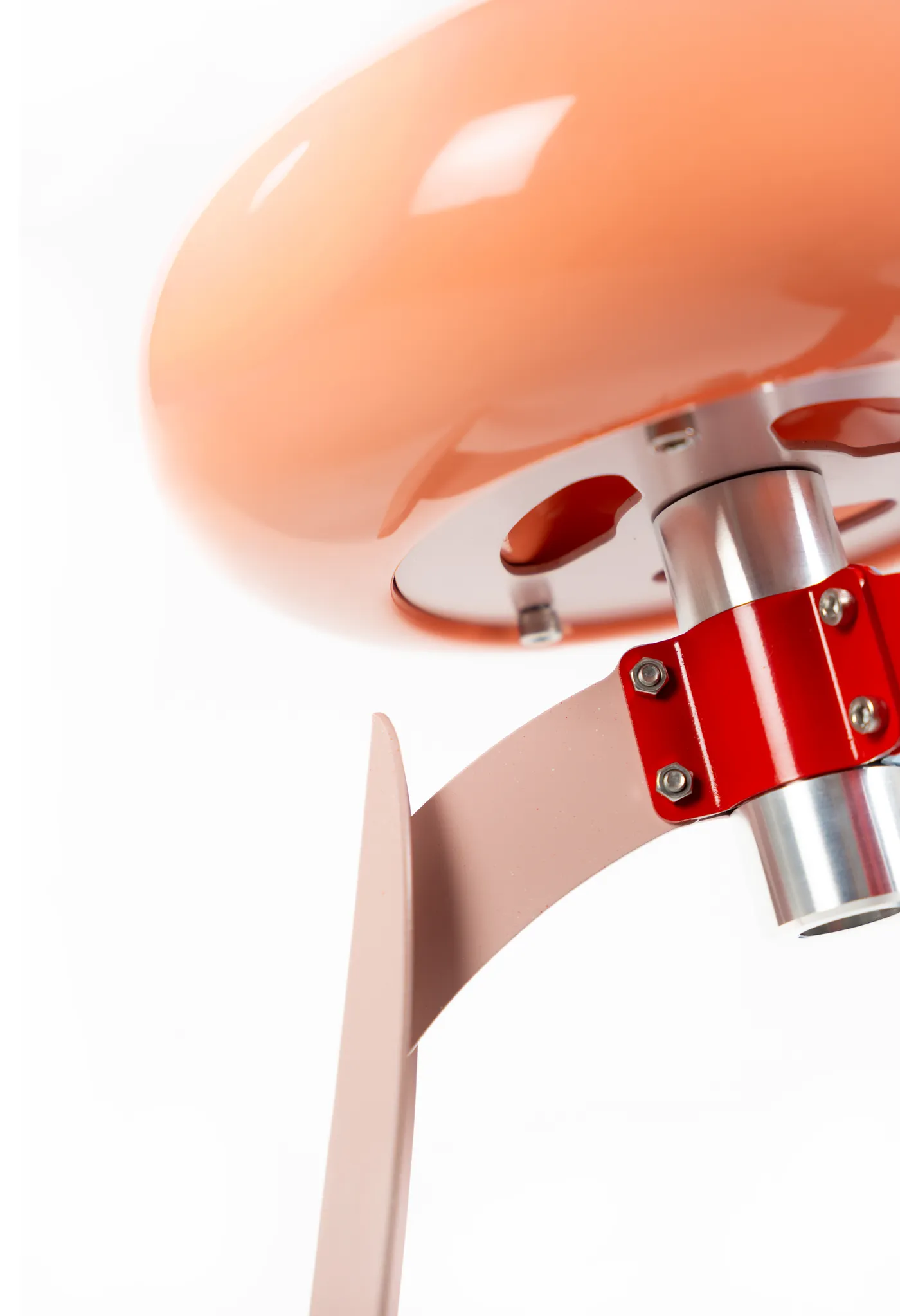 Detail of the red clamp joining seat and leg