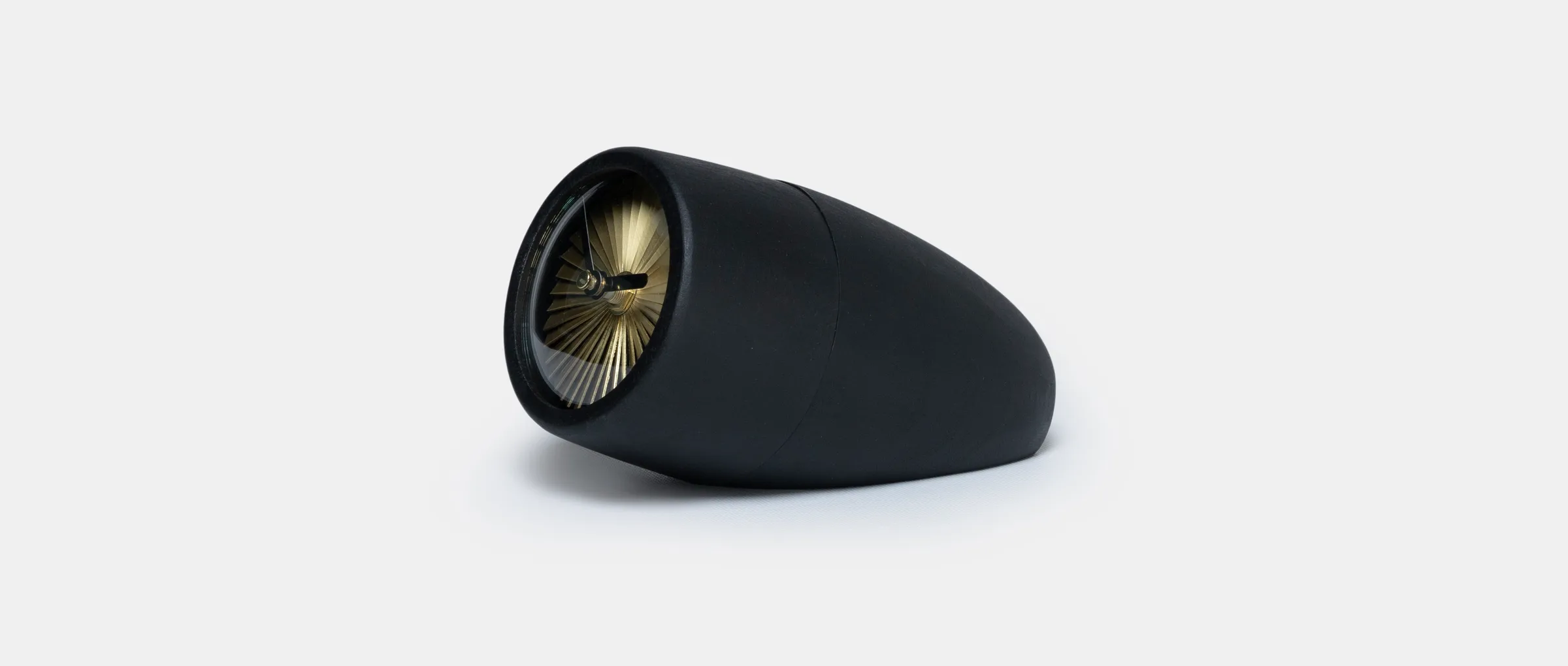 The Jeti clock in pale blue, resting on its side like a jet nacelle
