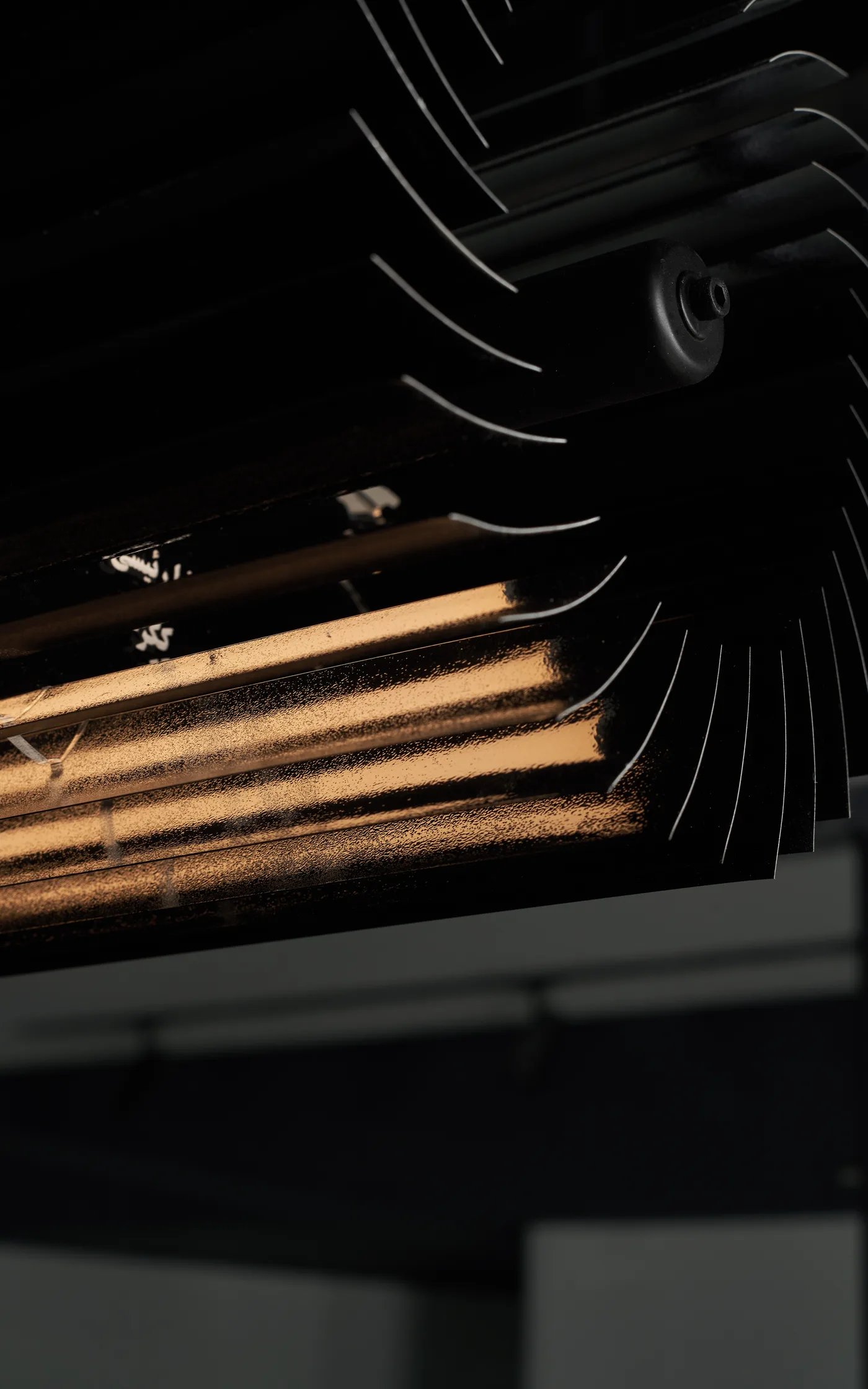 Underside of the black horizontal Keker, light breaking between the blades