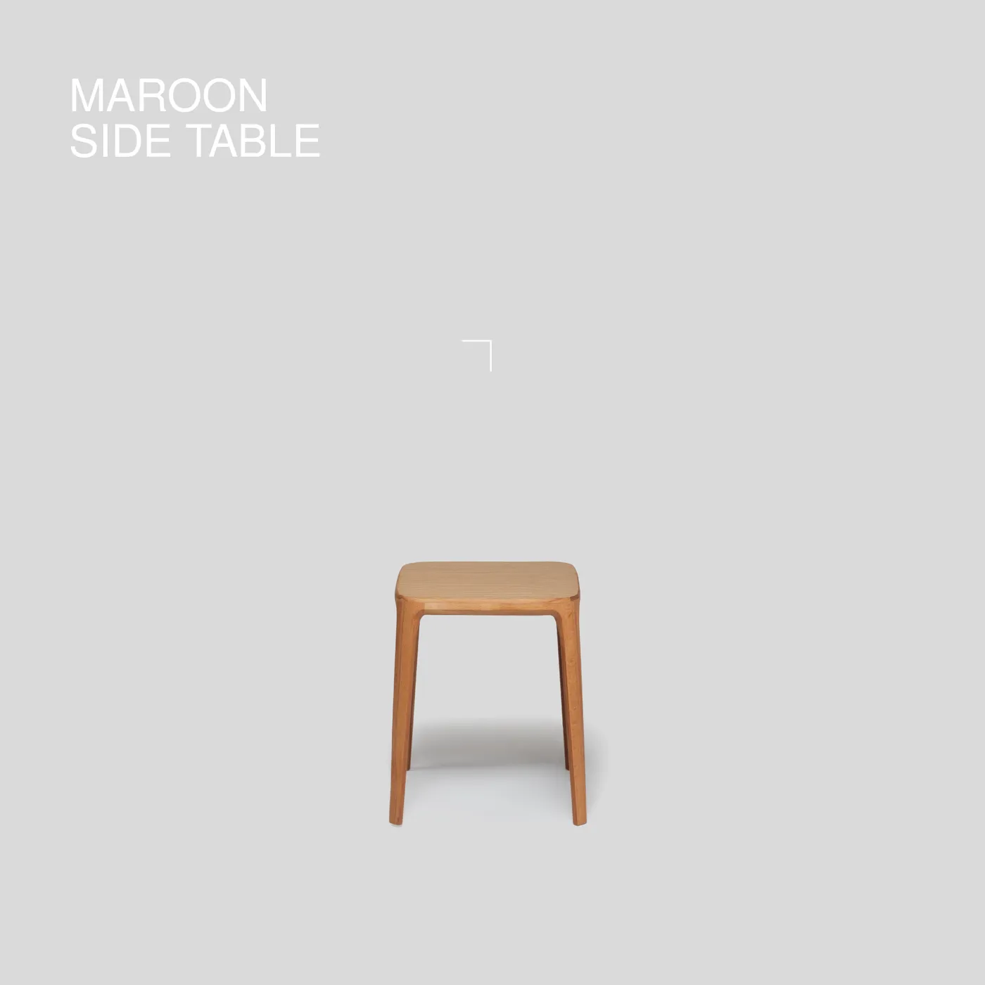 Maroon side table on its sculpted legs