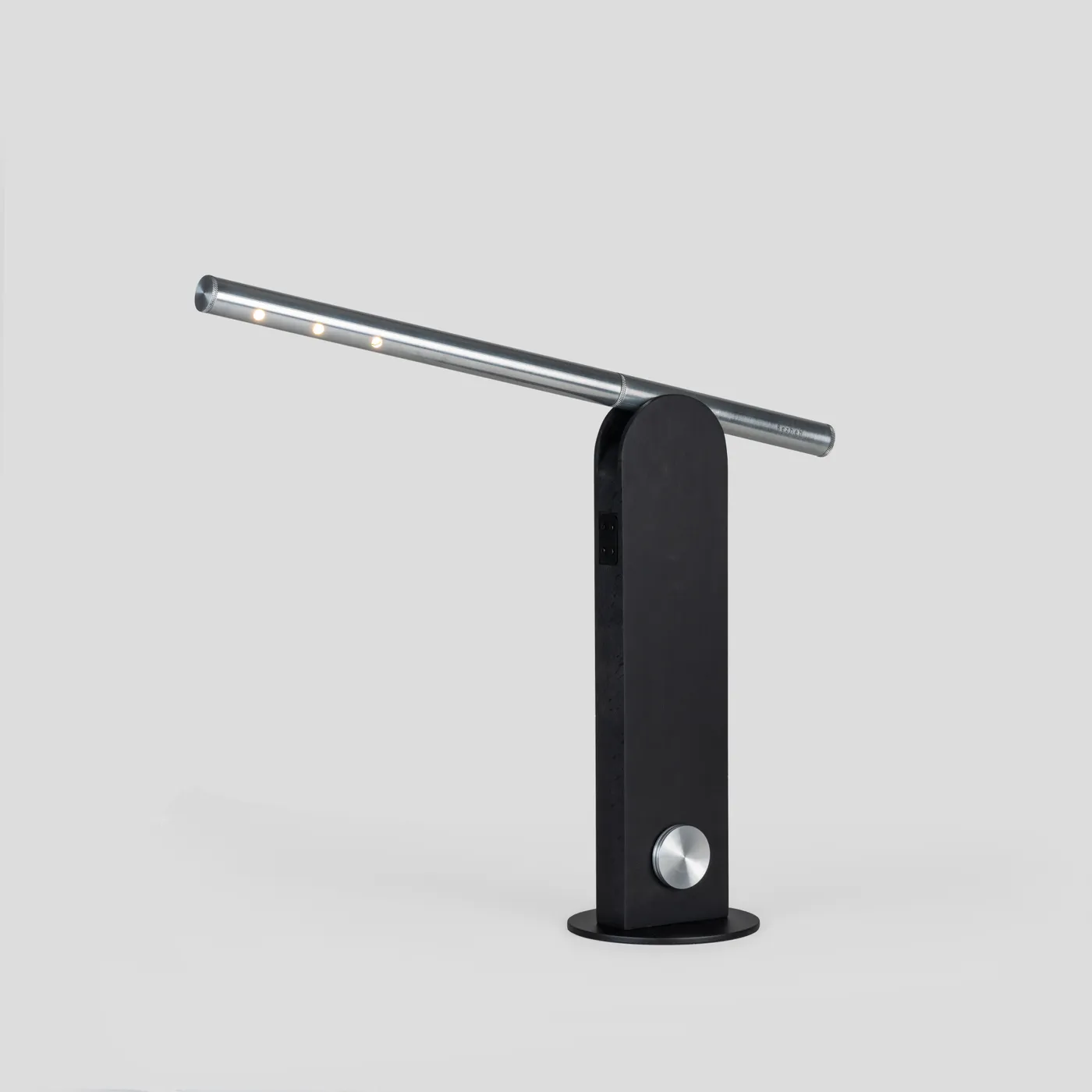 Parade in black with a silver arm, seen in profile
