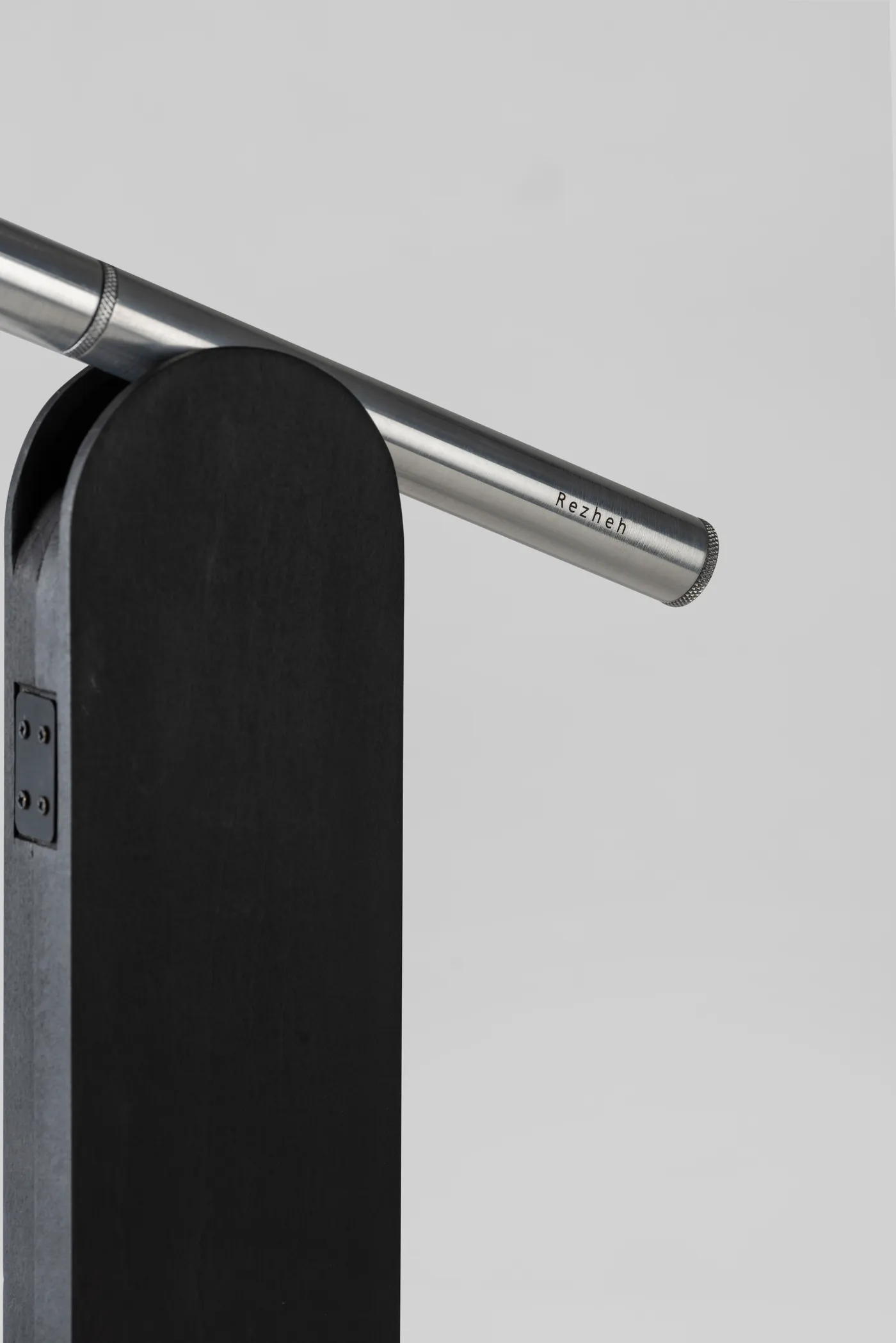 Detail of Parade's arched black body and cylindrical arm