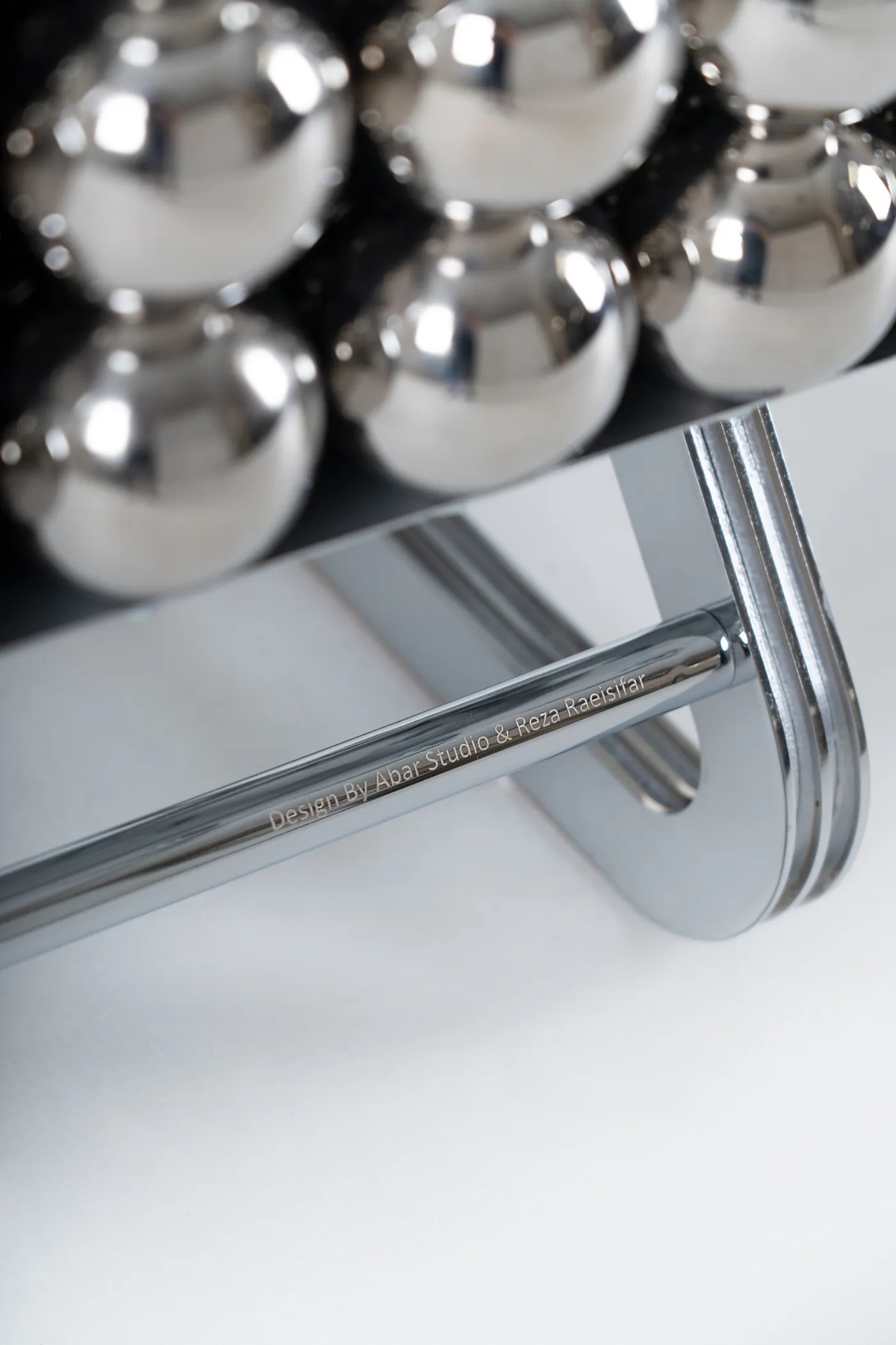 The polished steel frame beneath the Wishes bench
