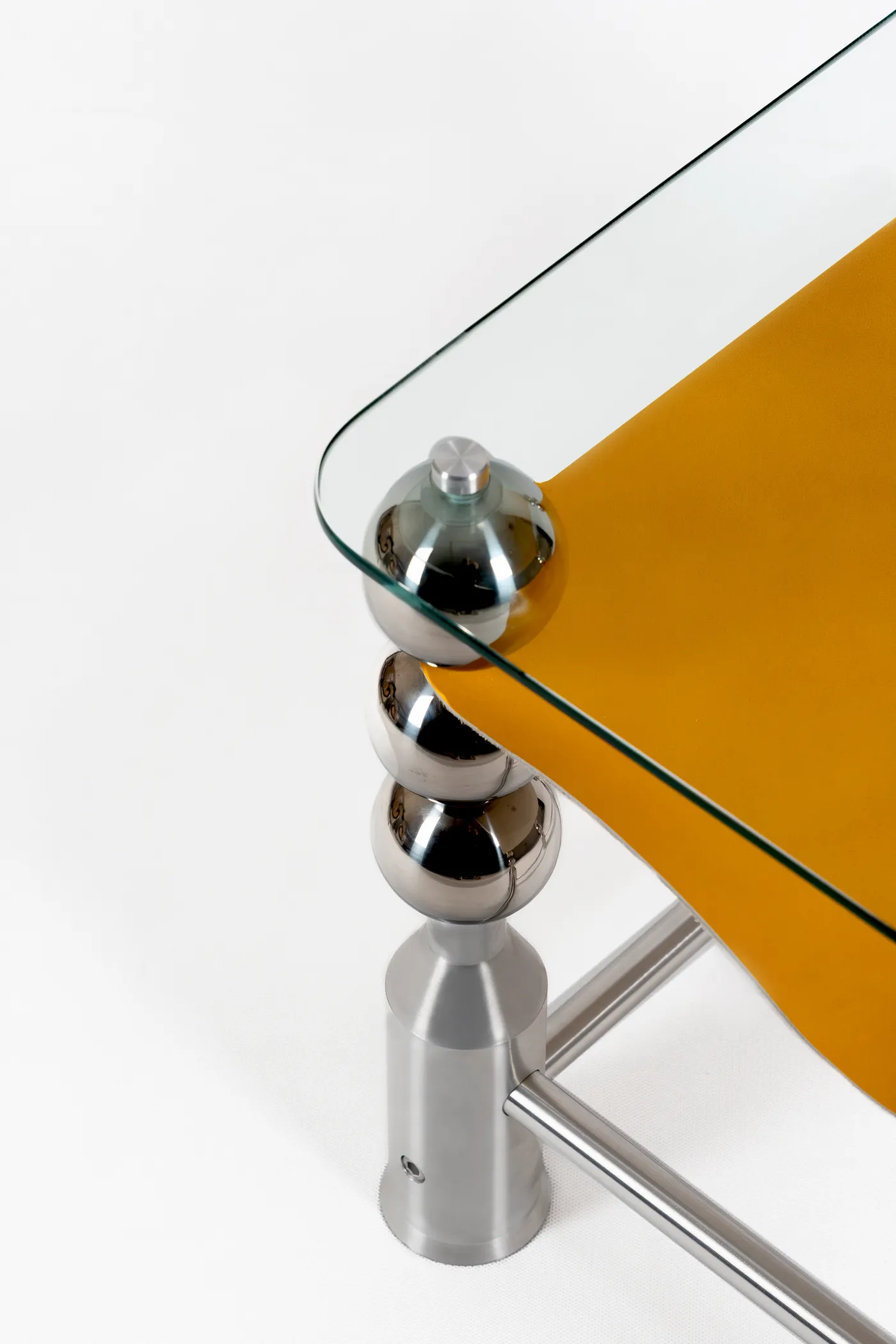 Corner detail of the Wishes table's glass and spheres
